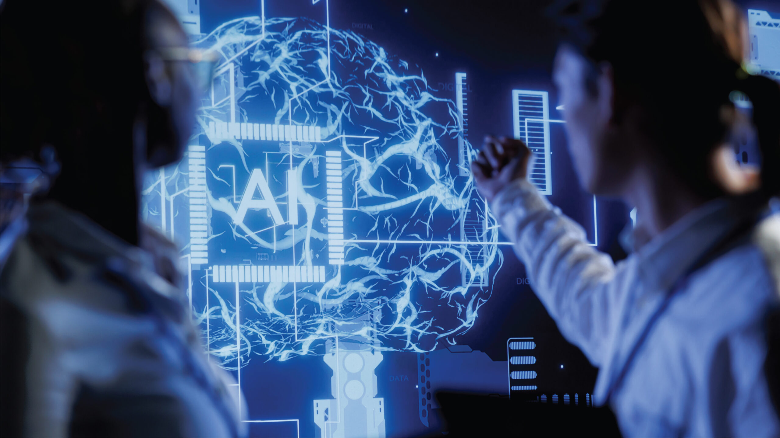 Two scientists, one pointing at a screen displaying a brain-like neural network with the letters "AI" embedded, likely discussing or researching artificial intelligence. A futuristic lab scene with scientists examining a holographic projection of a brain, symbolizing the development or study of advanced AI.